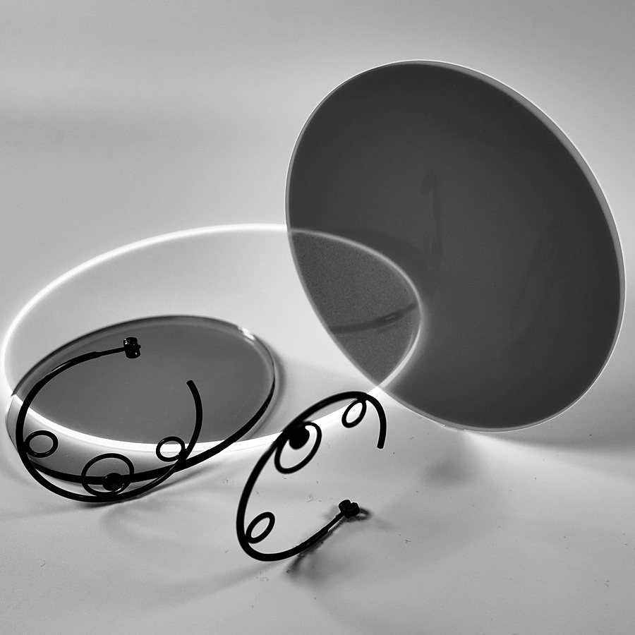 Black wire hoop earrings with small circles, black and white photo