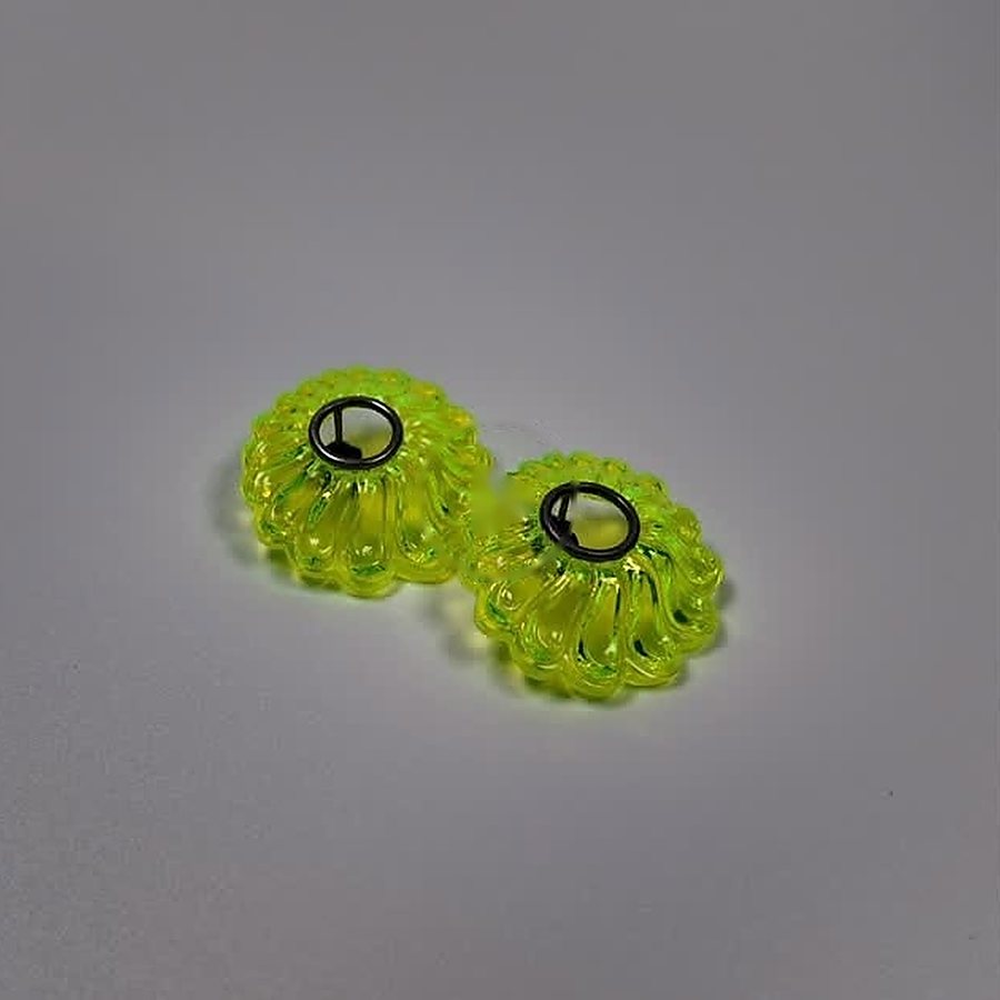 Pair of neon green acrylic flower-shaped stud earrings with oxidized silver rings
